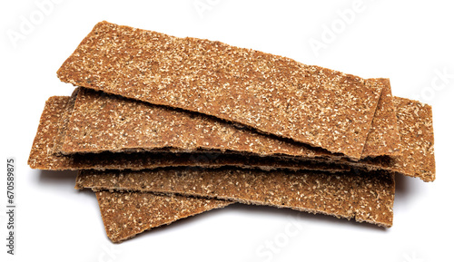 Slices of healthy low calories grain crisp bread for snack and crumbs on white background.