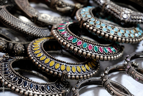 Indian bangles displayed in local shop in a market of Pune, India, These bangles are made of Gold, Silver and diamond as beauty accessories by Indian women.