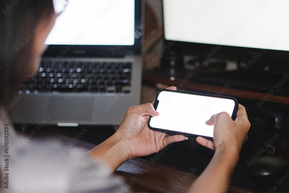 Mockup image of woman's hands holding black mobile phone with blank screen Mockup image of woman's hands holding black mobile phone with blank screen