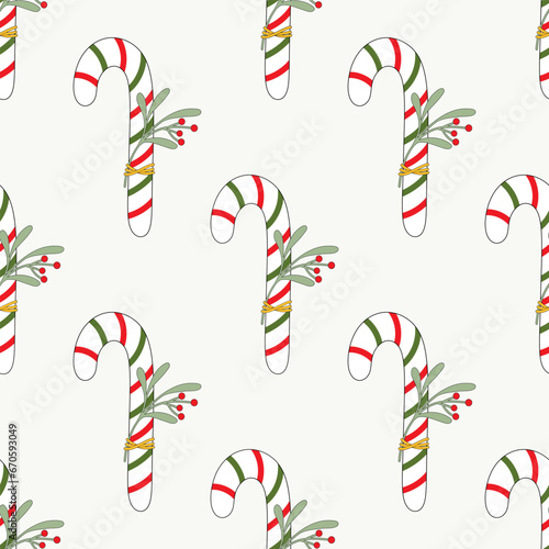 Seamless pattern of doddle Christmas candy canes on isolated background. Design for Christmas home decor, holiday greetings, Christmas and New Year celebration. 