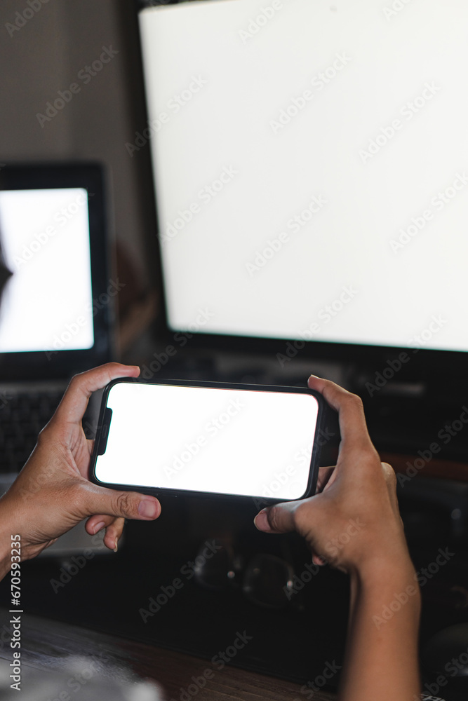 Mockup image of woman's hands holding black mobile phone with blank screen Mockup image of woman's hands holding black mobile phone with blank screen