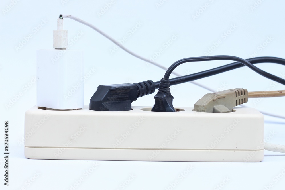 Plug the power plug, Multiple socket with connected plugs. isolated on white background Plug the power plug, Multiple socket with connected plugs. isolated on white background