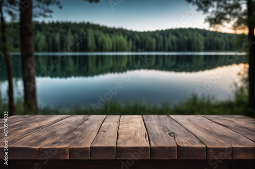 Empty Wooden Table with Lake and Forest Background at Dawn or Dusk