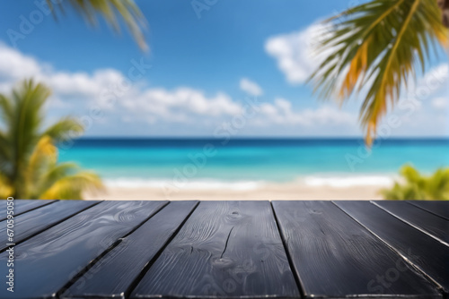 Empty Black Wooden Table with Blurred Beach Background © Reytr