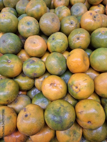 pile of Medan oranges or known as Citrus reticulata photographed at a high angle