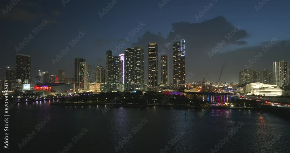 Miami Brickell in Florida, USA. Night cityscape of brightly illuminated shiny skyscraper buildings in downtown district. American megapolis with business financial district