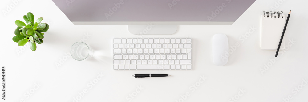Overhead shot of office desktop with computer Overhead shot of office desktop with computer