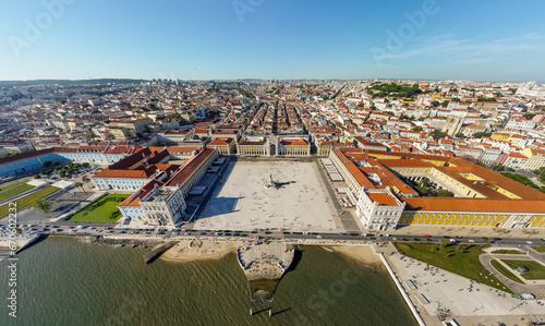 Aerial drone point of view of Commercio Square, Downtown Lisbon, Portugal. Panoramic view of cold city center. Travel destination visited annually by many foreigner tourists. Sunset colours 