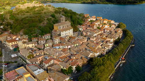 Aerial view of the historic center of Trevignano Romano. It is a small town in the metropolitan city of Rome, Lazio, Italy. It is located on the volcanic Lake Bracciano. photo