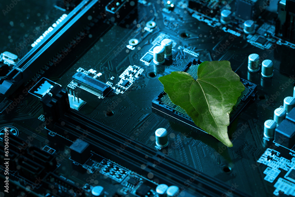 Fototapeta premium Heart shaped green leaf inside a Computer Circuit Board. Green technology and Environmental technology. Green Computing, CSR, IT ethics.Nature with Digital Convergence and Technological Convergence.