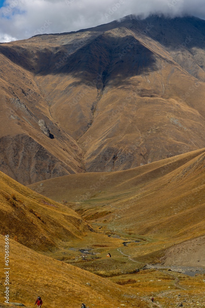Fototapeta premium Vertical shot of views near a mountain trail in the village of Juta, Georgia