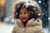 Small African American boy enjoying the first snow