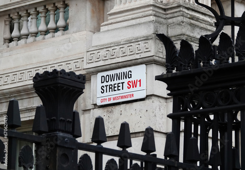 Downing Street sign on the wall of government building in Westminster, London, UK. 