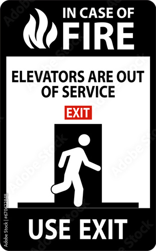 In Case Of Fire Sign Elevators Are Out of Service, Use Exit