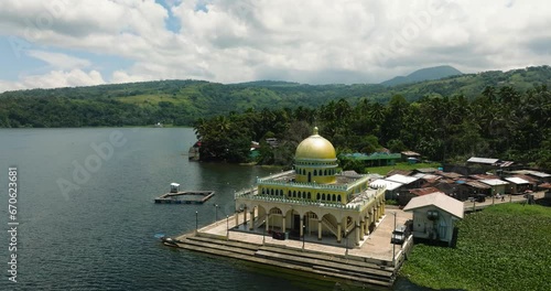 Beautiful view of Linuk Masjid a mosque beside the Lake Lanao in Lanao del Sur. Mindanao, Philippines. photo