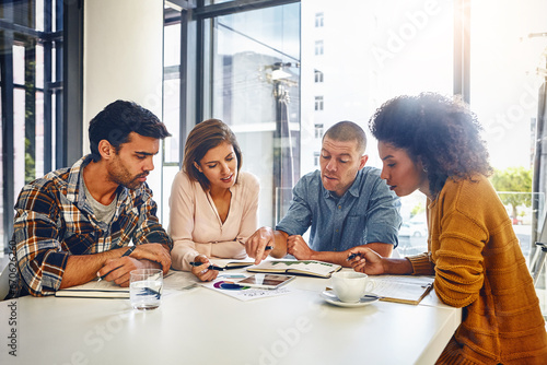 Editor, planning and teamwork in business meeting, office or press newspaper with writers in publishing. News, agency and group of people with strategy for report, newsletter and review of ideas