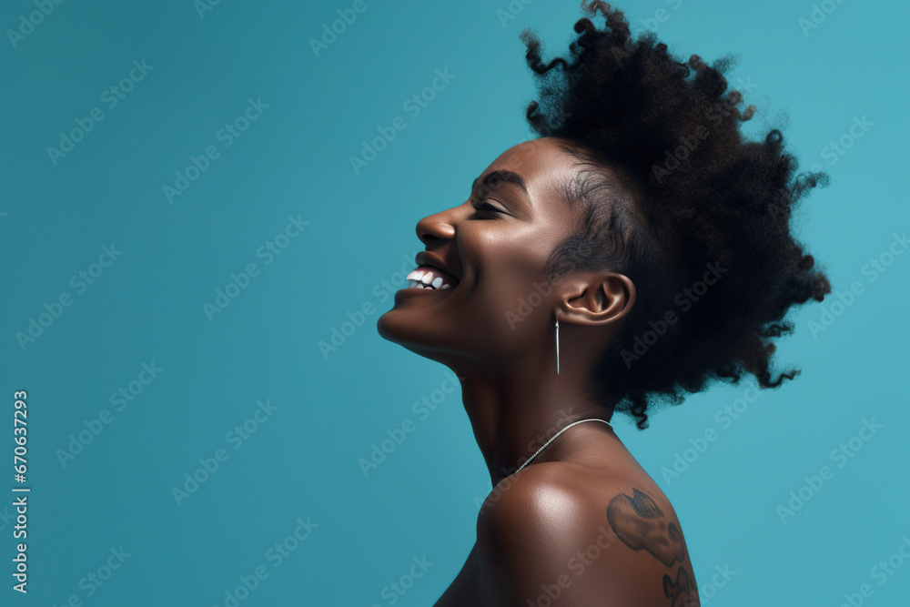 a black woman smiling on blue background