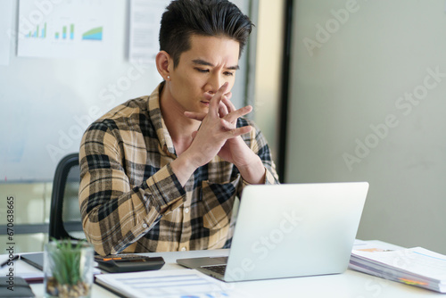 Young business man busy working at office. businessman doing fin