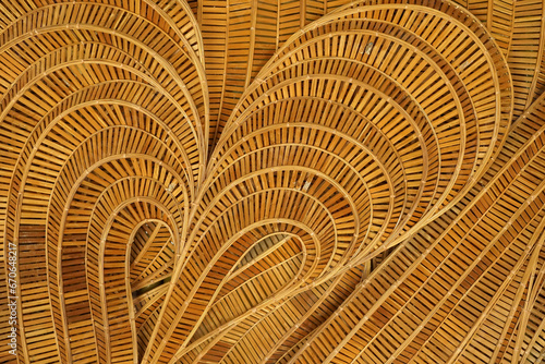 abstract curve pattern that twists and turns smoothly and flows like water waves Made from woven bamboo For building decoration in a modern tropical contemporary style or for making furniture.