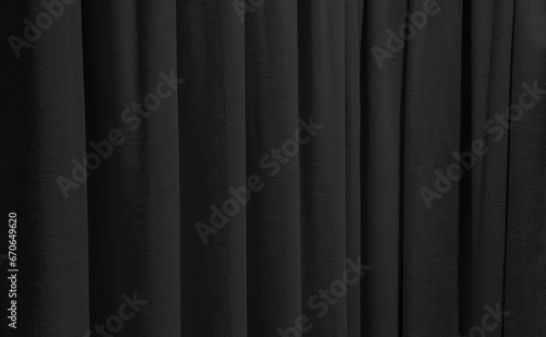 close up dark black curtains use as background. sack cloth texture drape for minimal interior design. black natural linen drape curtains background. beautiful interior home design backdrop.