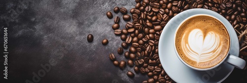Banner with copy space area, steaming cup of cappuccino standing on a table, close-up shot, Coffee beans. The logo made from the coffee on the cup is visible from a slightly angled top-down view. photo