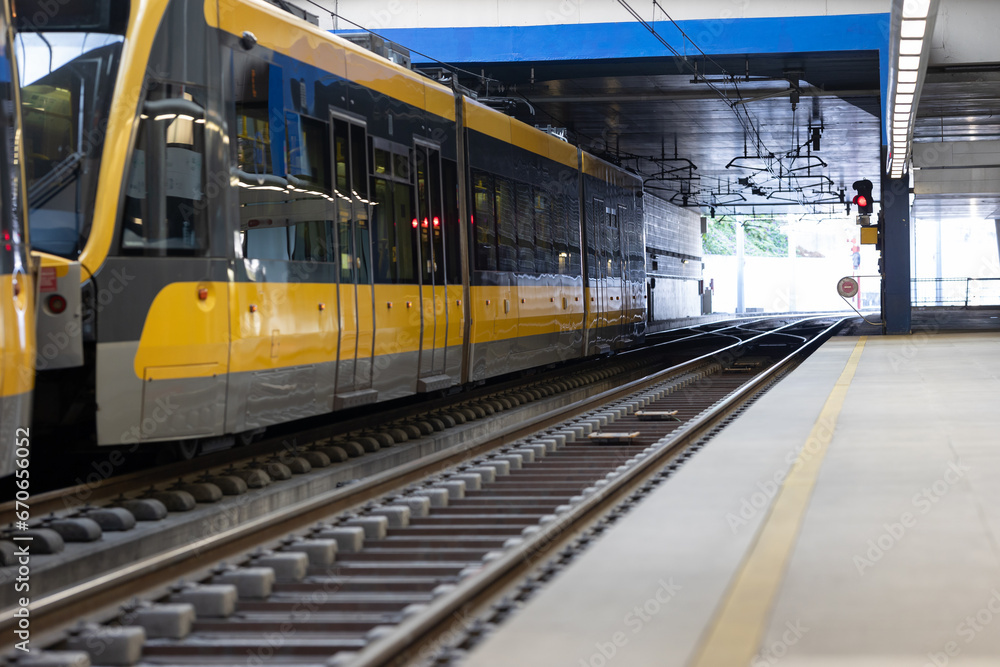Fototapeta premium A train arriving at a bright station.