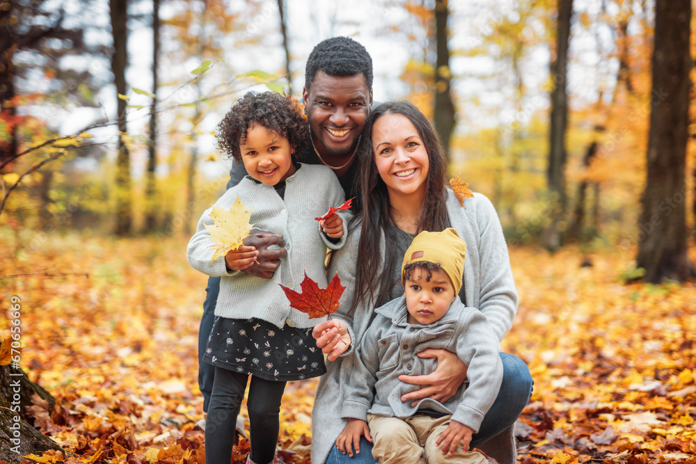 happy family playing on autumn park togerher happy family playing on autumn park togerher