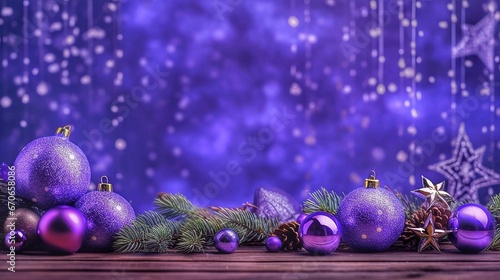 Christmas background with purple baubles and fir branches on wooden table