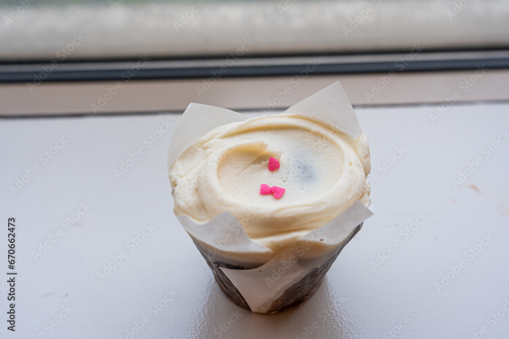 Closeup chocolate cupcake with a vanilla buttercream frosting