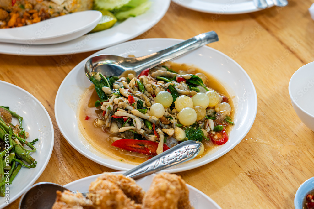 Stir fried spicy catfish roe and Razor clam with Thai herbs
