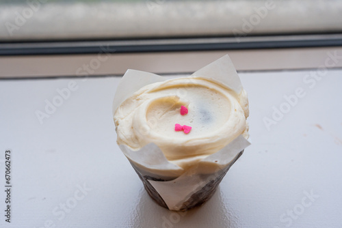 Closeup chocolate cupcake with a vanilla buttercream frosting