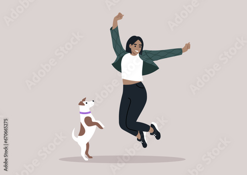 A female pet owner jumping with their Jack Russell puppy, both filled with happiness and excitement