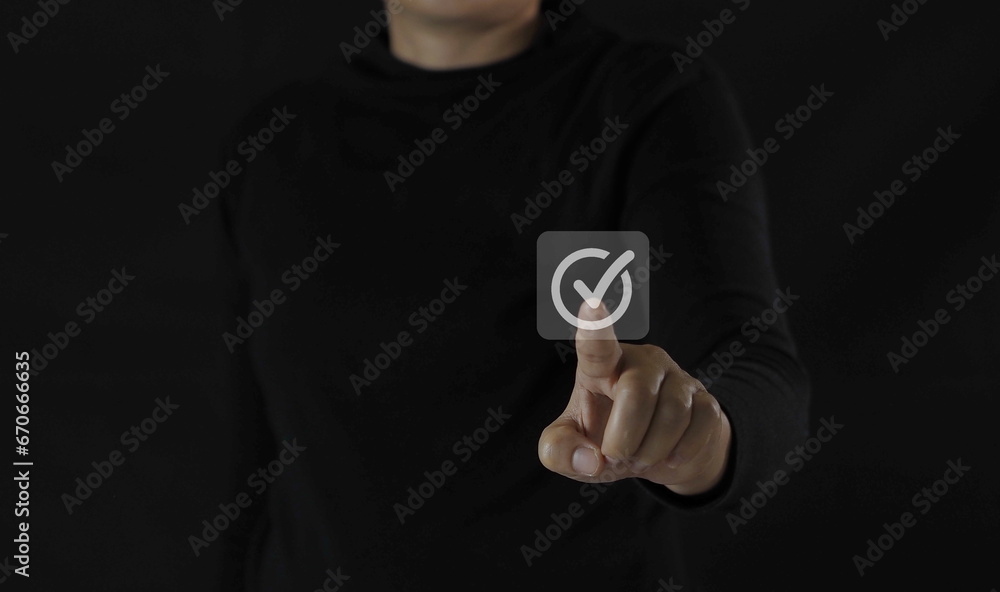 Businessman's hand touching correct glowing sign for document approval and project approval concept with copy space. Businessman's hand touching correct glowing sign for document approval and project approval concept with copy space.