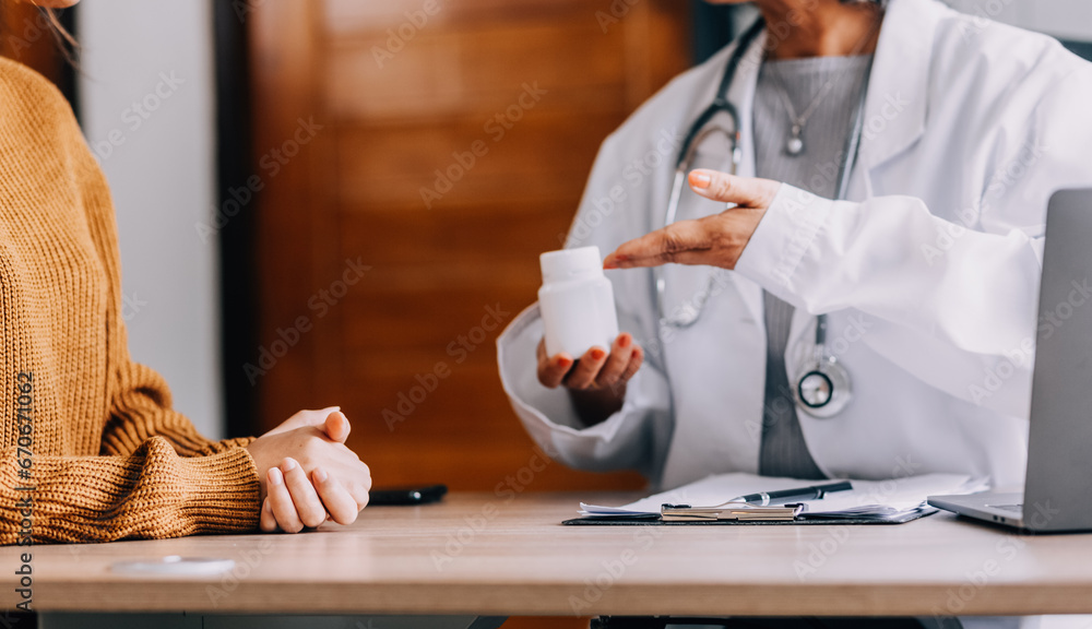 Doctor presenting with patient and checking results on report and prescription about the problem of illness and recommend using medicine, healthcare and medical concept.