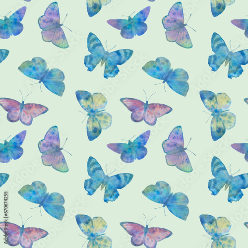 seamless pattern of multi-colored butterflies on a white background for wallpaper, print and wrapping paper. © Sergei