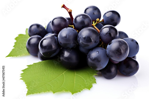 Bunch of dark blue grapes on white