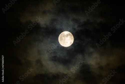 Full Moon Behind The Dark Clouds