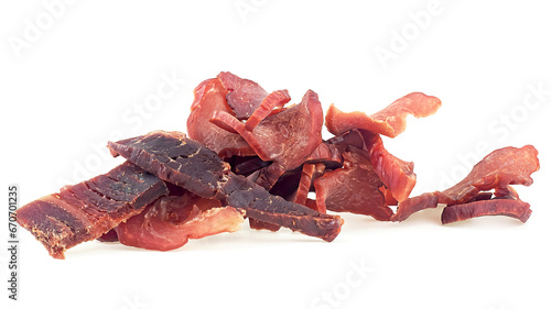 Portion of sliced and dried meat isolated on a white background. Pile of pork jerky pieces.