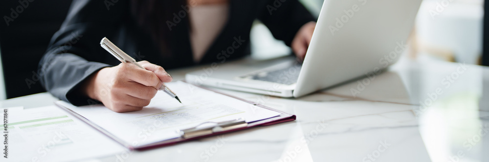 Young asian woman secretary working with laptop at contemporary office.. Young asian woman secretary working with laptop at contemporary office..
