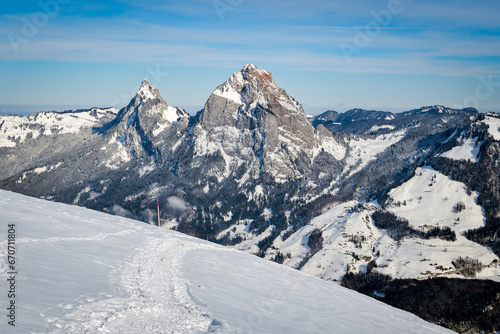 Fototapeta Naklejka Na Ścianę i Meble -  Walking trail on snow with beatutiful views on mountains