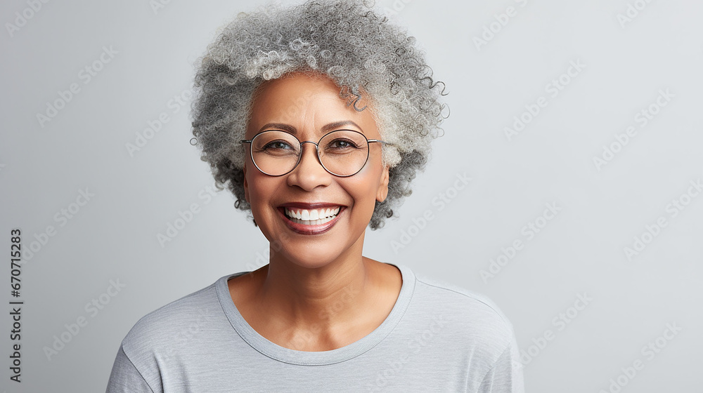 Beautiful black woman with smooth healthy facial skin. Beautiful aged mature woman with short gray hair and happy smile. Beauty and skin care cosmetics advertising concept. Beautiful black woman with smooth healthy facial skin. Beautiful aged mature woman with short gray hair and happy smile. Beauty and skin care cosmetics advertising concept.