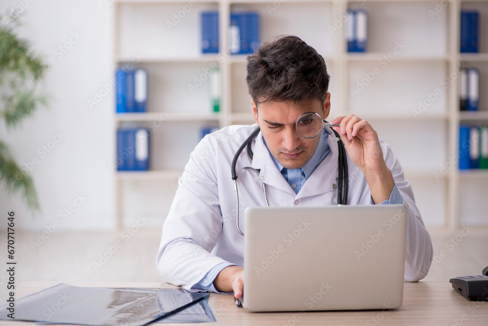 Young male doctor in telemedicine concept Young male doctor in telemedicine concept