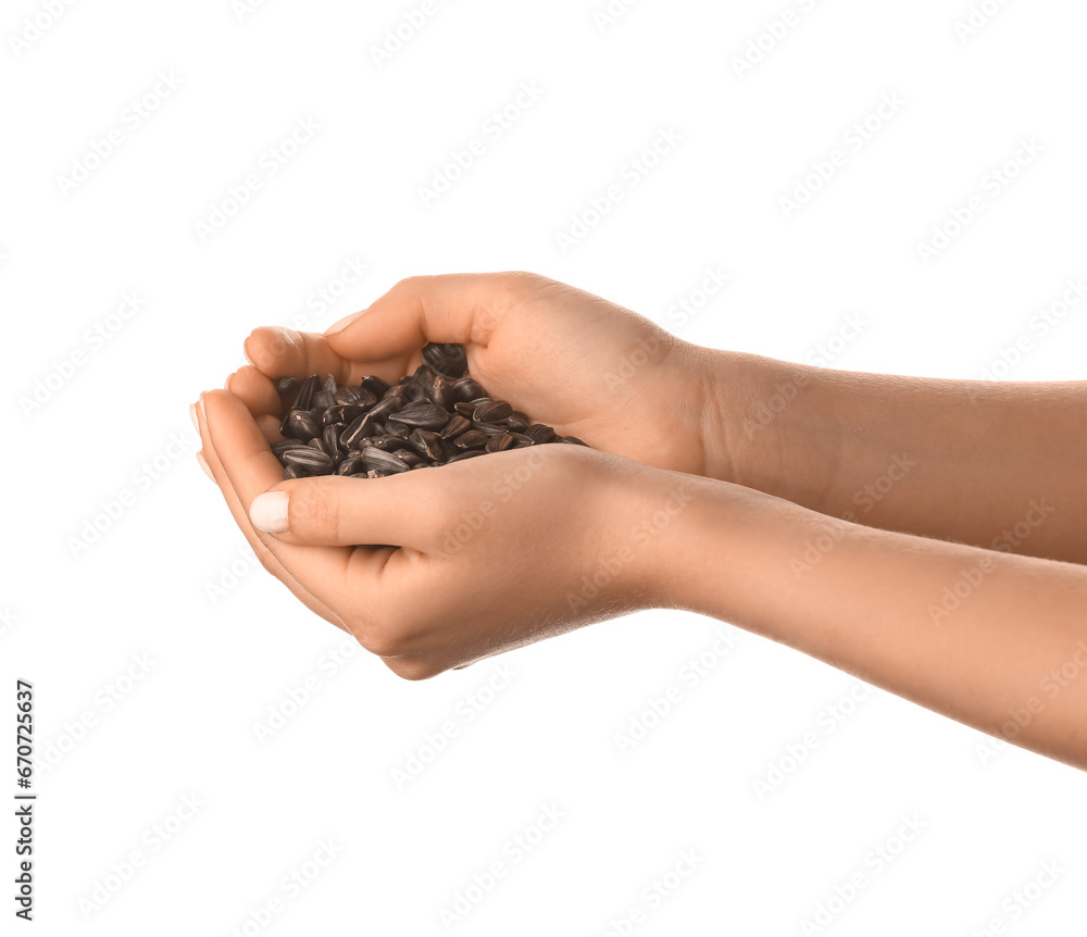 Woman holding sunflower seeds on white background Woman holding sunflower seeds on white background