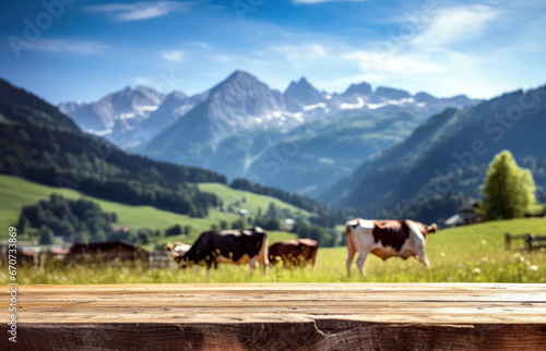 Empty rustic old wooden boards table copy space with cows grazing on alpine meadow in background, some mountains at distance. Dairy milk product display template. Generative AI