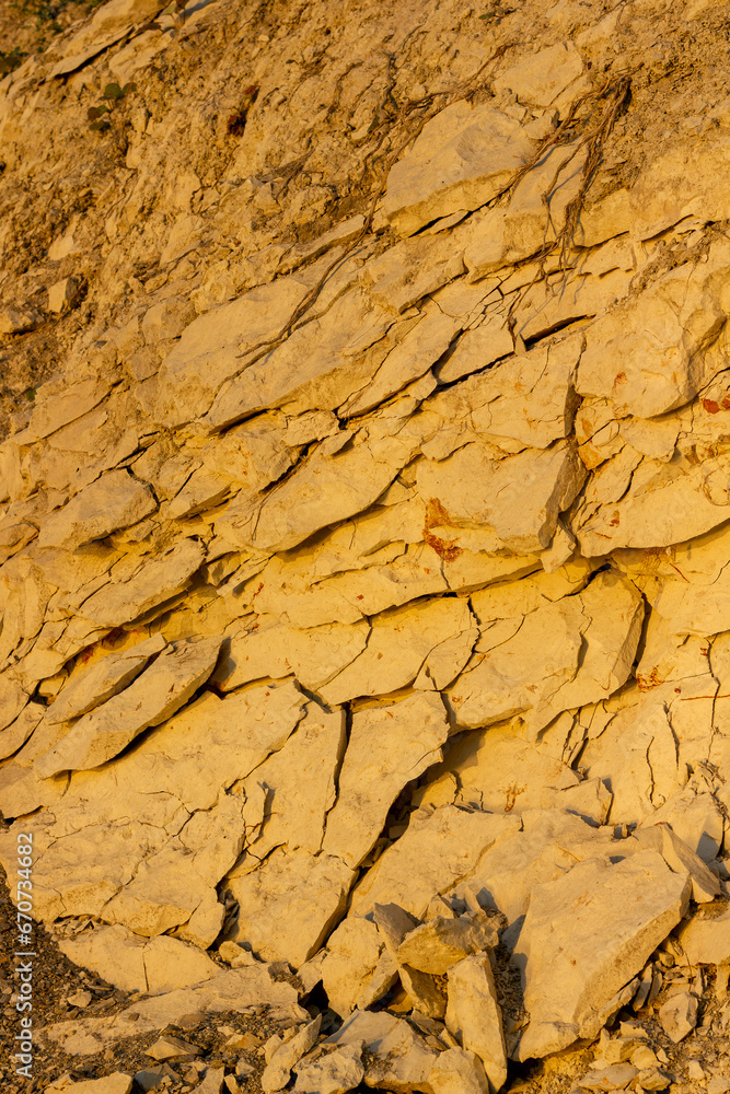scree from the mountain on the shore stones from opoka at the golden hour, close-up texture scree from the mountain on the shore stones from opoka at the golden hour, close-up texture