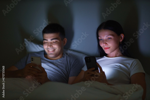 Young couple using mobile p...
