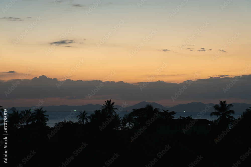 Twilight in Thailand - close up view on palms, sea and mountains at horizon line. Ao Nang, Thailand Twilight in Thailand - close up view on palms, sea and mountains at horizon line. Ao Nang, Thailand