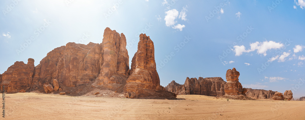 Rocky desert formations with sand in foreground, typical landscape of Al Ula, Saudi Arabia. High resolution panorama - obrazy, fototapety, plakaty 