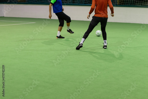 Futsal players rivals in action. Sport mini soccer futbol sala concept.