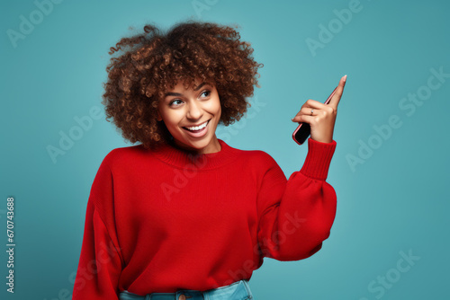 Black woman over isolated green background pointing finger. a young woman pointing on a plain blue background